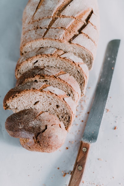 White ceramic plate of brown bread
